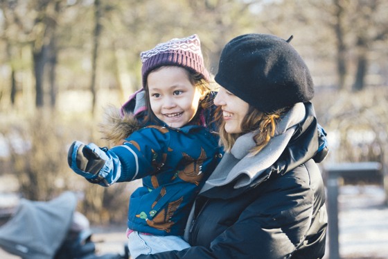 Mother and child plays in the park